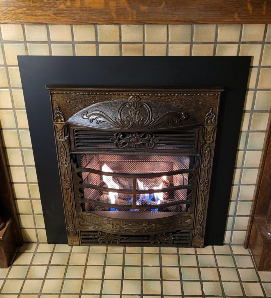 gas fireplace with antique front cover