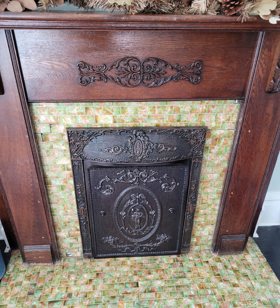 antique fireplace surround with summer cover