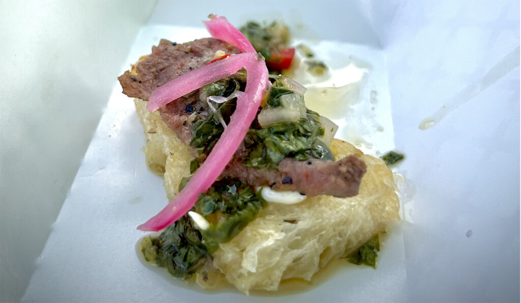 specialty gas house winning dish at smoke and fire festival picanha steak with chimichurri on focaccia bread