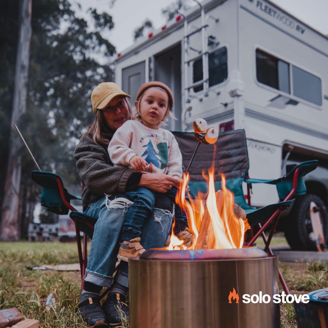 Solo Stove smokeless wood burning fire pit camping Roasting Marshmallows mom and son